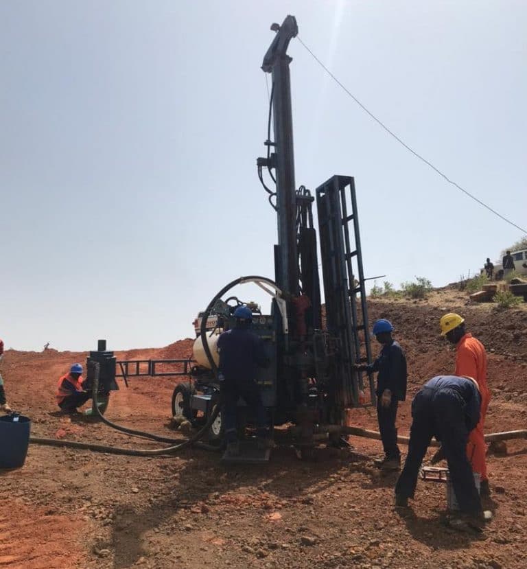 Creating an access road and clearing the drill pads on these steep